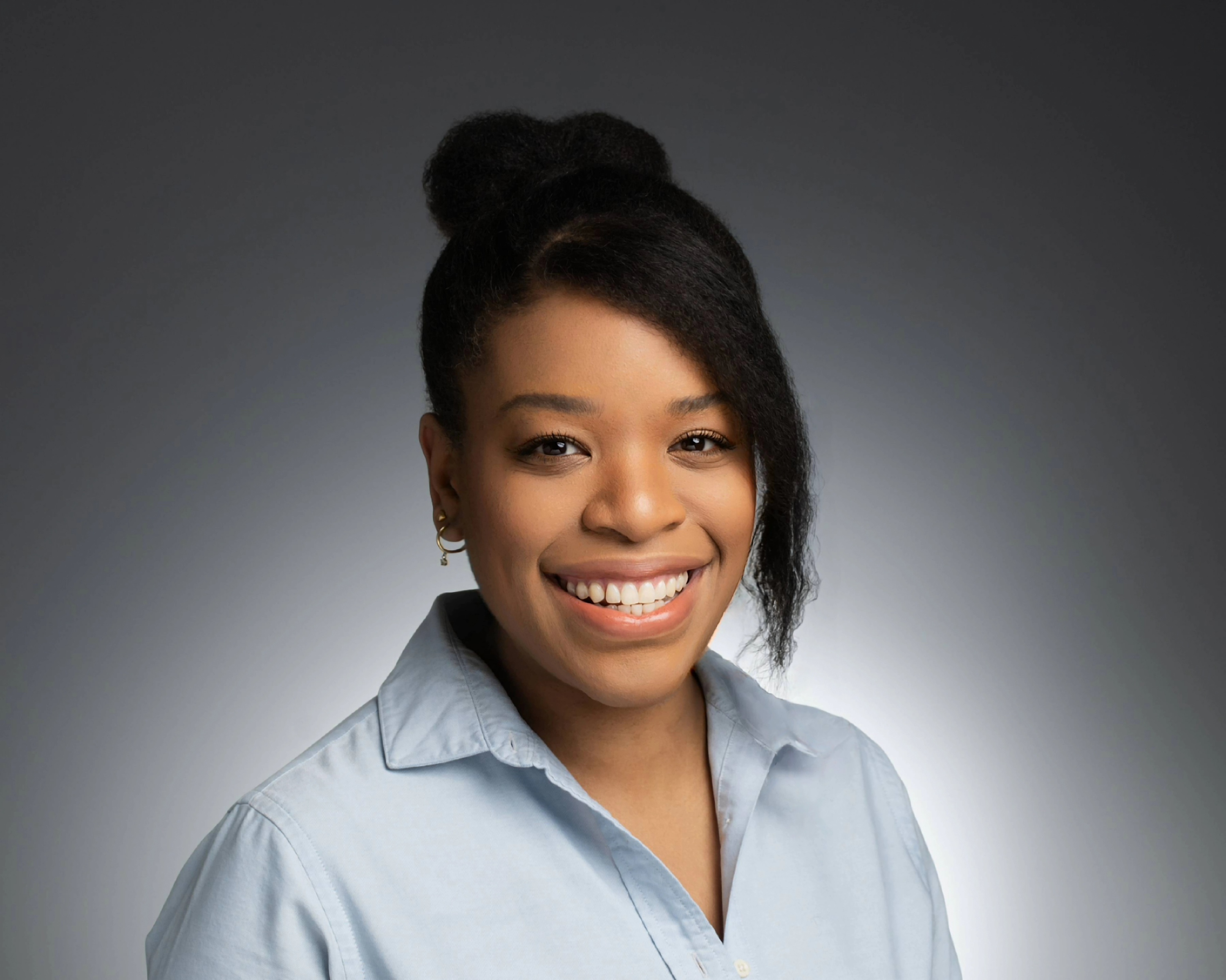 Professional headshot of Dr. Chantel Johnson smiling against a neutral studio background.